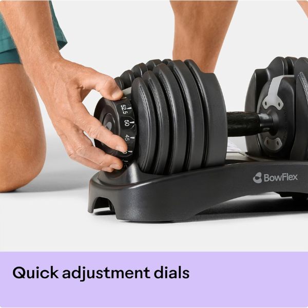 Bowflex SelectTech 552 adjustable dumbbells with dial weight adjustment system in a modern home gym.