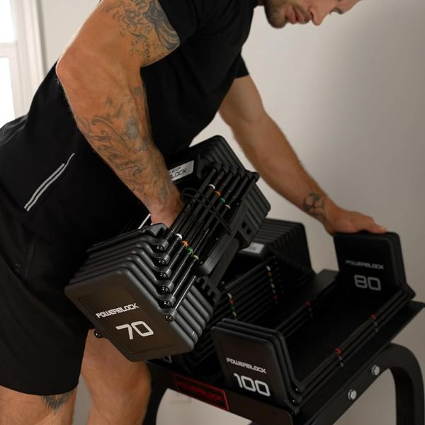 PowerBlock Pro 100 EXP adjustable dumbbells with expandable weight system for home gym workouts.