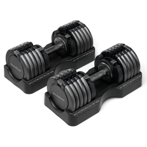 NordicTrack Select-A-Weight adjustable dumbbells with adjustable weight settings in a home gym.