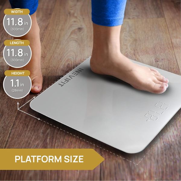 INEVIFIT smart scale with digital display measuring body weight and body fat percentage in a bathroom setting.